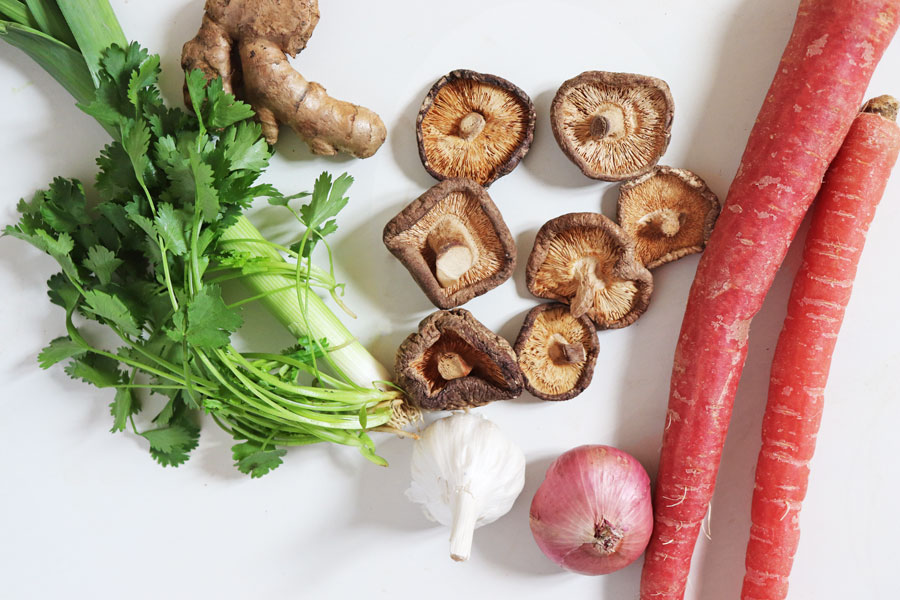 Mushrooms, Carrots, Onion, Garlic, Ginger, and Herbs used to make Vegan Bone Broth